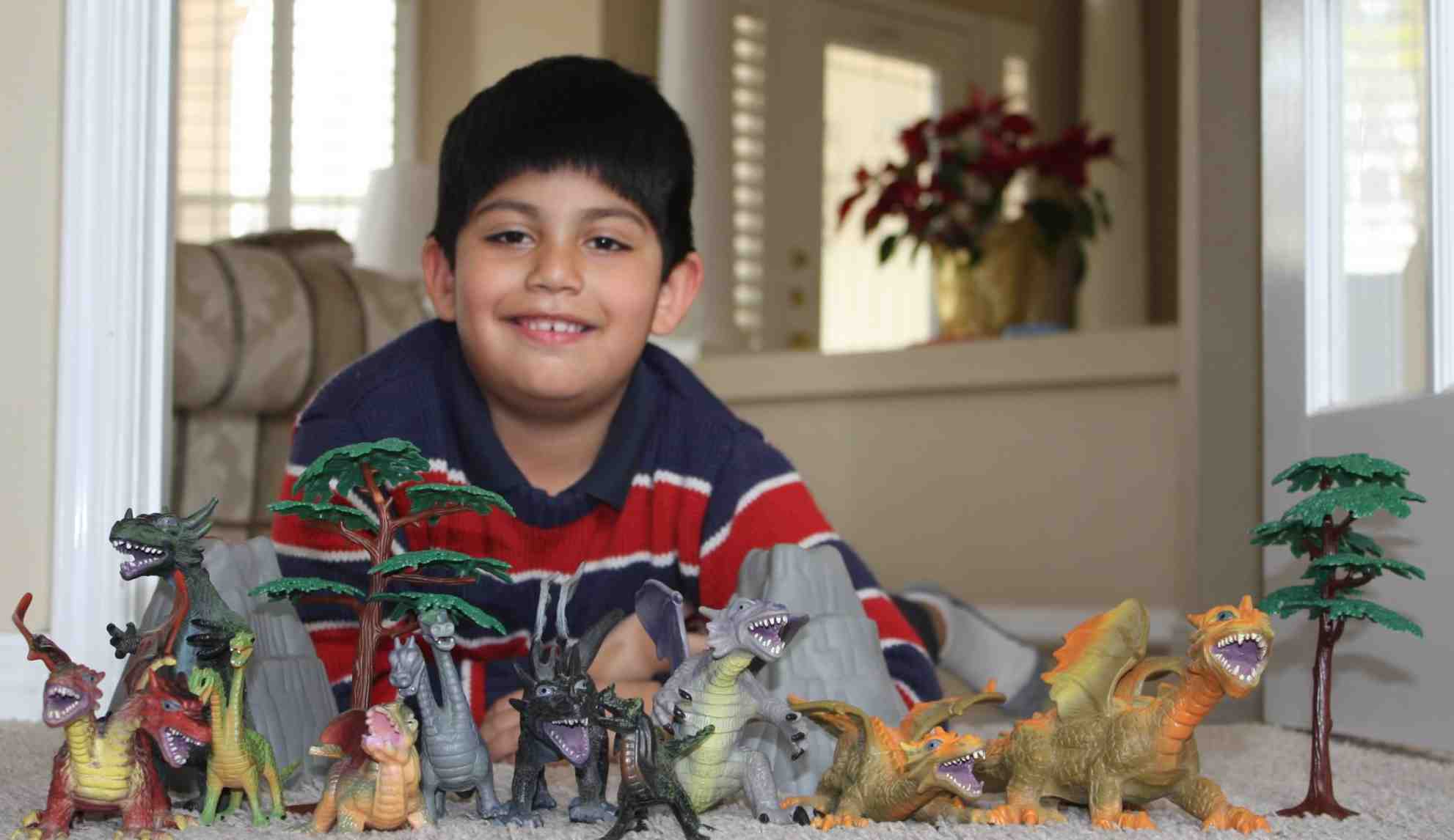 Ryan With His Toy Dinosaurs